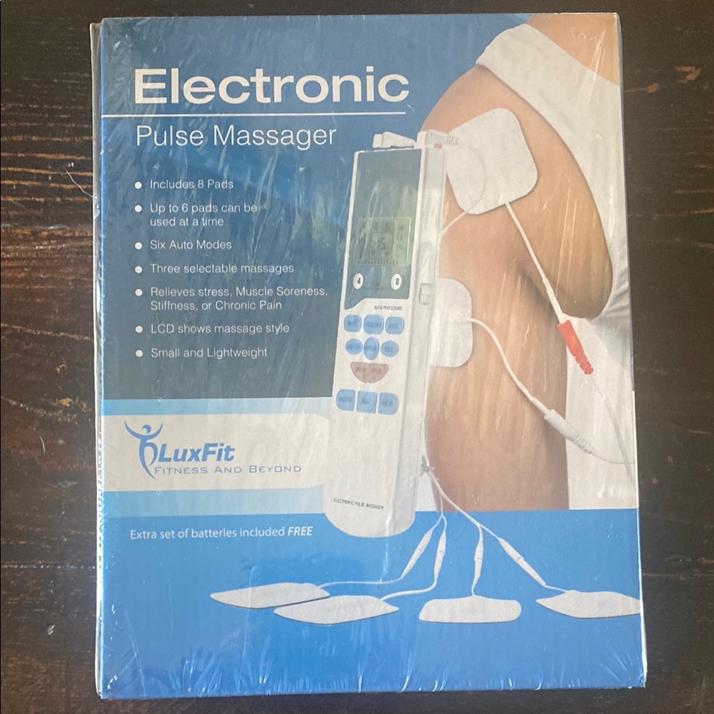 Electronic Pulse Massager - White. New in box. Never opened.